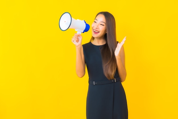 Portrait beautiful young asian business woman use megaphone for communication