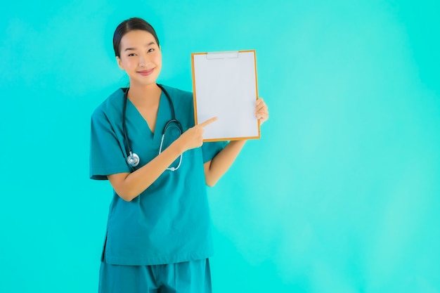 Portrait beautiful young asian doctor woman with empty paper board for copy space