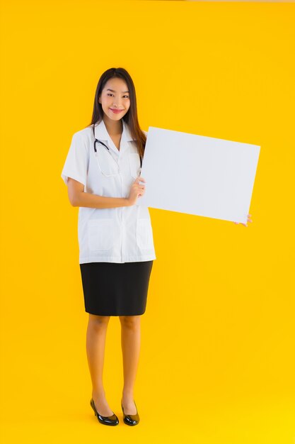 Portrait of beautiful young asian doctor woman with empty white board