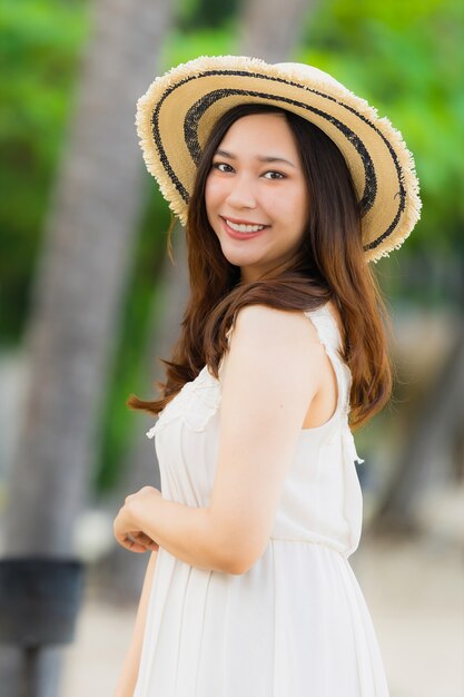 Portrait beautiful young asian woman happy and smile on the beach sea and ocean