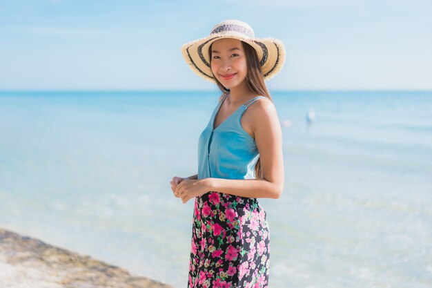 Portrait beautiful young asian woman happy smile relax around beach ocean and sea