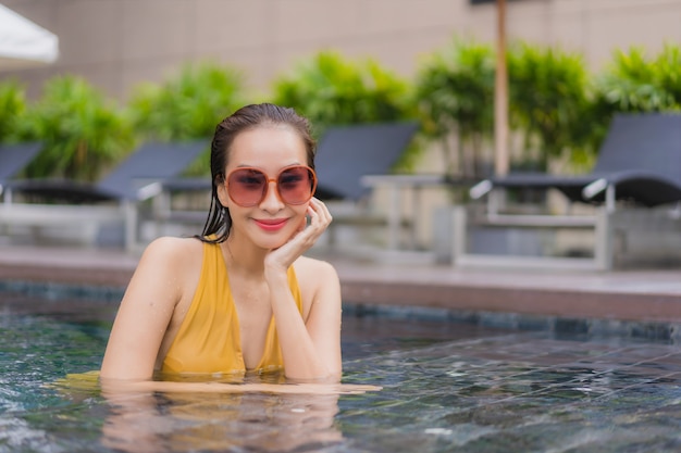 Portrait beautiful young asian woman relax leisure around swimming pool