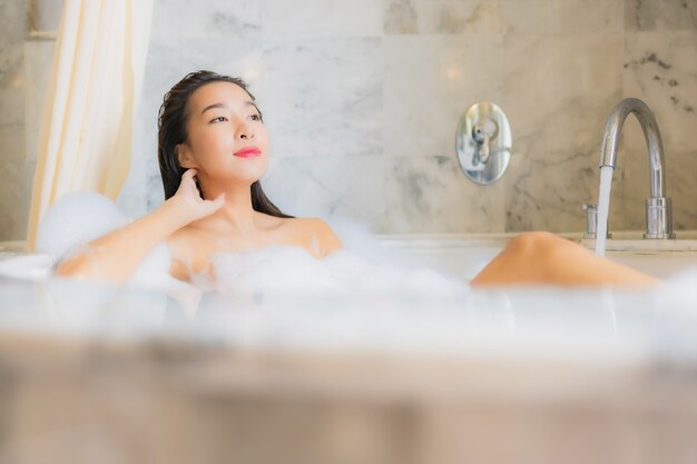 Portrait beautiful young asian woman relaxes take a bath