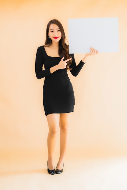 Portrait beautiful young asian woman show empty white board