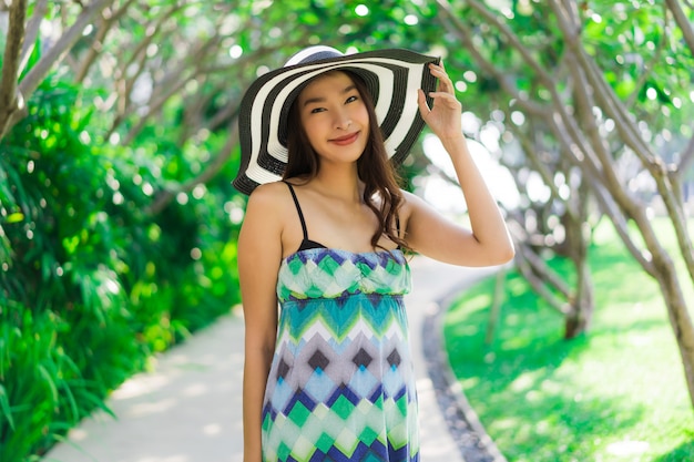 Portrait beautiful young asian woman smile and happy around outdoor garden