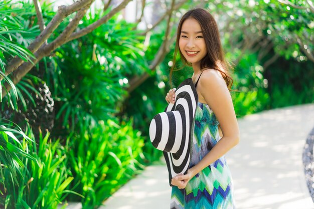 Portrait beautiful young asian woman smile and happy around outdoor garden