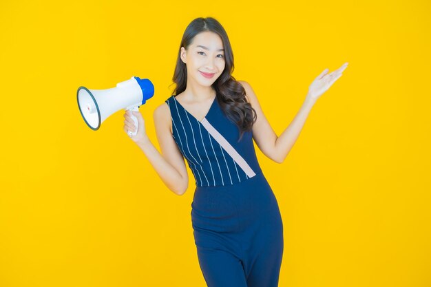 Portrait beautiful young asian woman smile with megaphone on