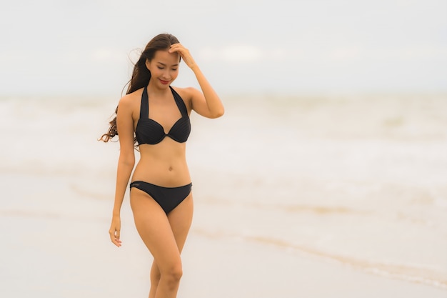 Portrait beautiful young asian woman wear bikini on the beach sea ocean