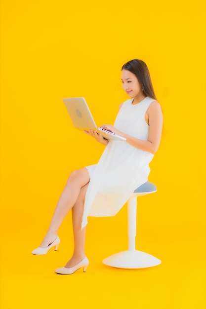 Portrait beautiful young asian woman with computer laptop