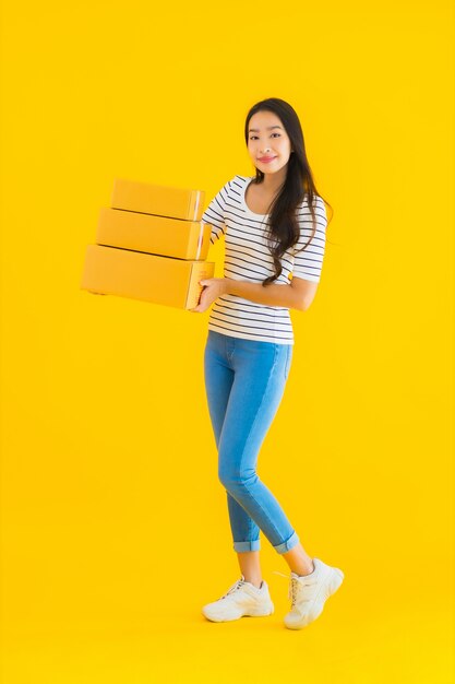 Portrait beautiful young asian woman with parcel box ready for shipping