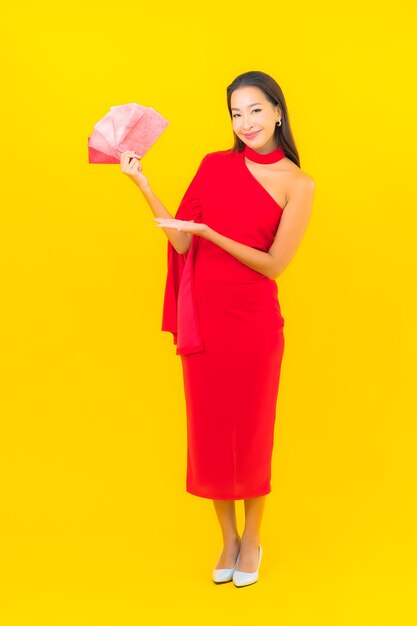 Portrait beautiful young asian woman with Red envelope letter