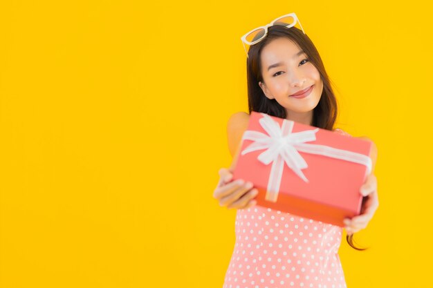 Portrait beautiful young asian woman with red gift box