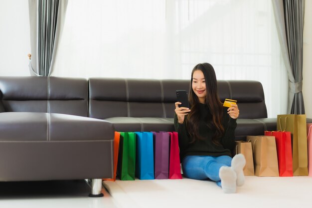 Portrait beautiful young asian woman with shopping bag and credit card