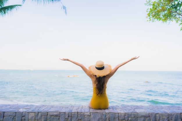 Portrait beautiful young asian women happy relax smile around sea beach ocean