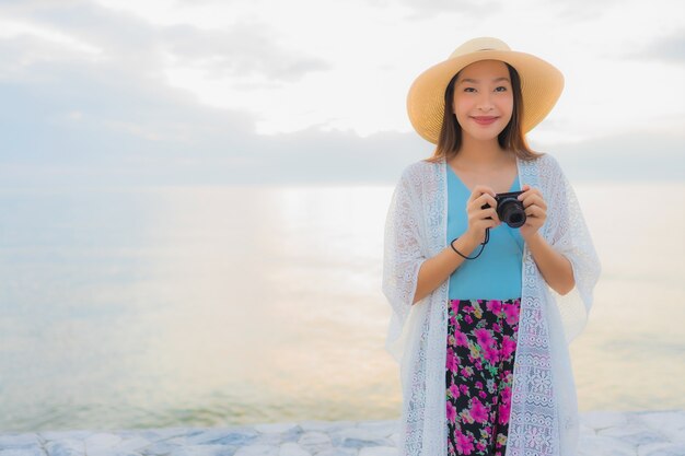 Portrait beautiful young asian women happy smile relax around sea beach ocean