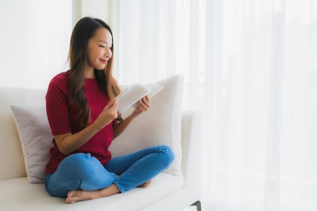 Portrait beautiful young asian women read book on sofa chair