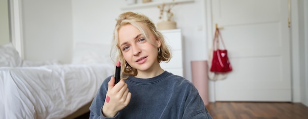 Free photo portrait of beautiful young woman content creator for social media sitting in front of digital