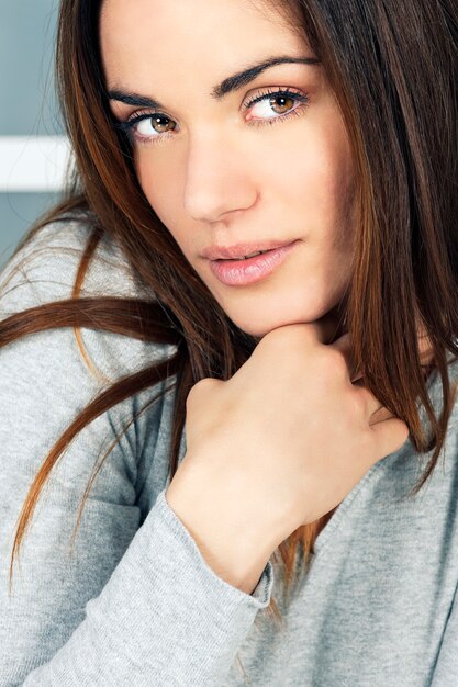 Portrait of beautiful young woman at home