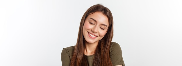 Portrait of a beautiful young woman looking at the camera and smiling isolated on a white background