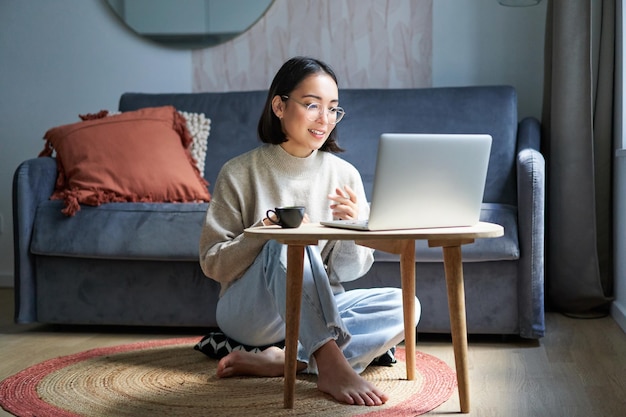 Portrait of beautiful young woman professional working on remote from home freelancing with her lapt