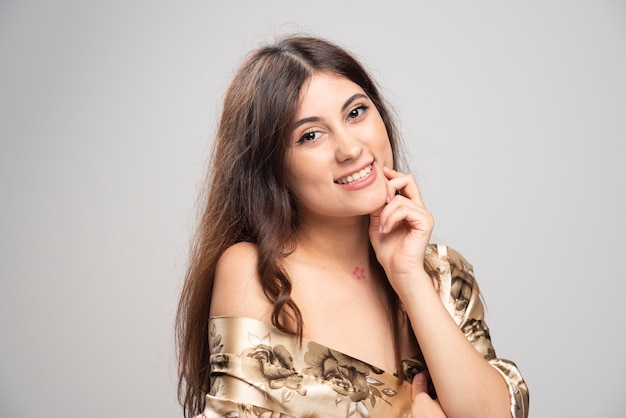 Portrait of beautiful young woman standing 