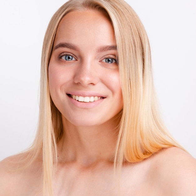 Portrait of beautiful young woman with clear skin