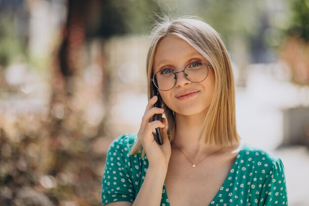 Portrait of blonde woman in the street