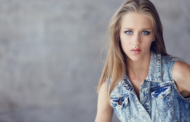 Free Photo portrait of blue eyes young woman in denim jacket.