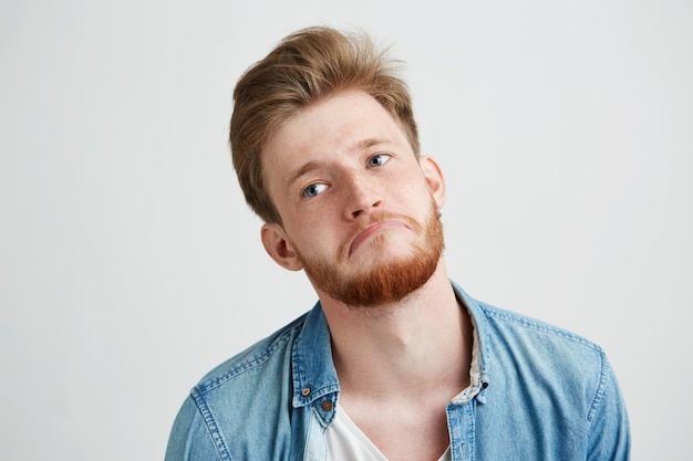 Portrait of bored tired upset sad man with beard.