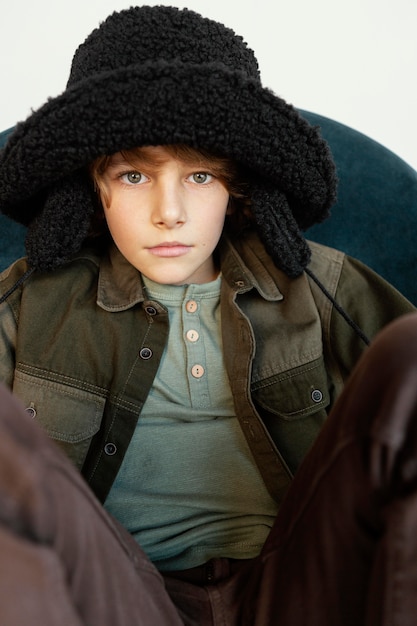 Free photo portrait boy wearing winter hat