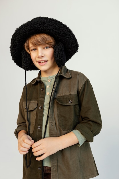 Free Photo portrait boy wearing winter hat