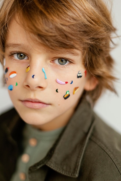 Free photo portrait boy with face painted