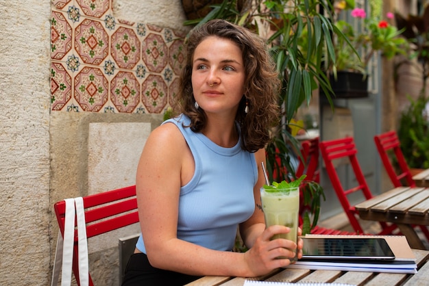 Portrait of braless woman outdoors at cafe