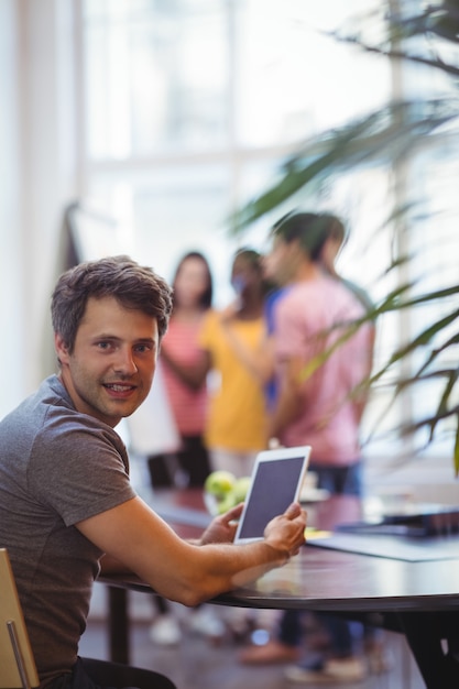 Portrait of business executive using digital tablet