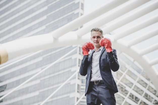 Portrait of businessman in boxing gloves