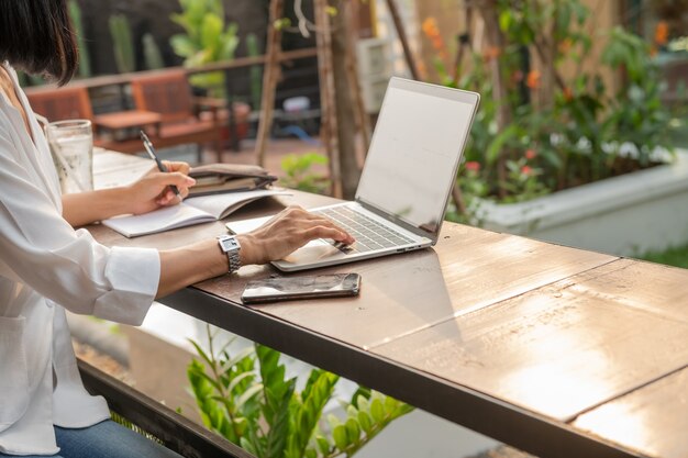 Portrait of businesswoman in a cafe using a laptop