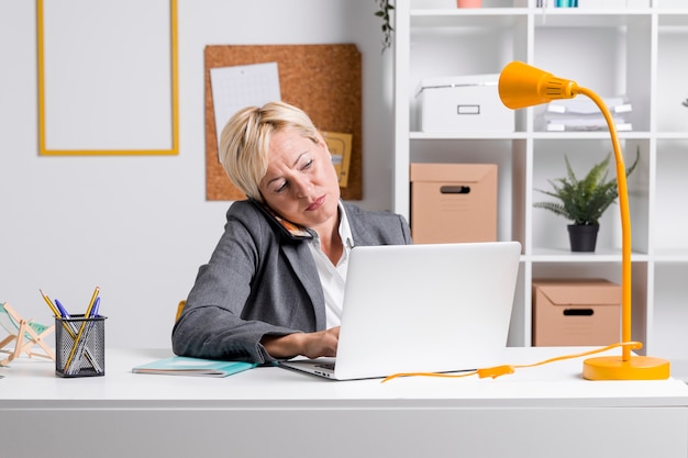 Portrait of businesswoman at desk