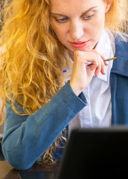 Portrait of businesswoman at her workspace