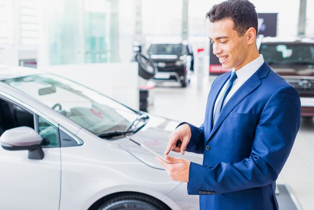 Portrait of car salesman