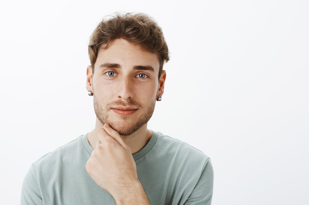 Portrait of a casual guy posing in the studio