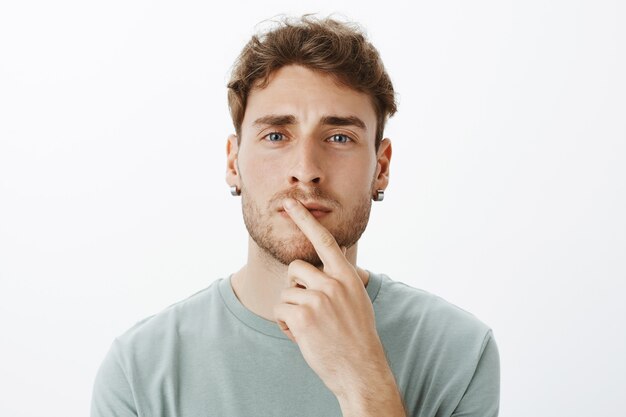 Portrait of a casual guy posing in the studio