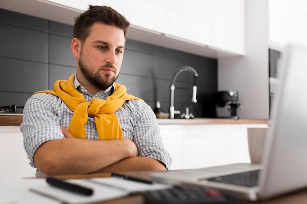 Portrait of casual male video conferencing