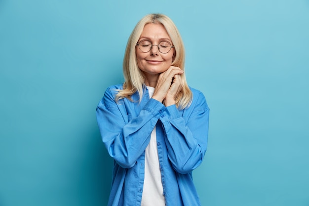 Free Photo portrait of charming middle aged attractive woman with blonde hair