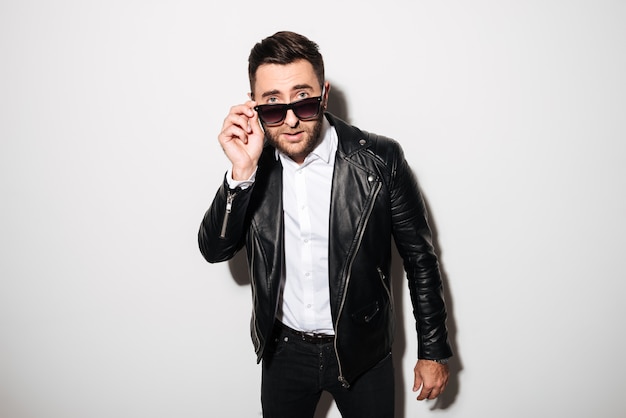 Portrait of a charming young man in sunglasses