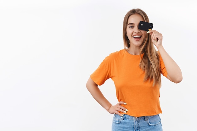 Free Photo portrait of cheerful blond girl in orange t-shirt