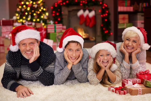 Portrait of cheerful family in the living room