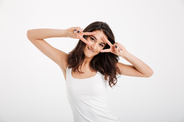 Portrait of a cheerful woman dressed in tank-top