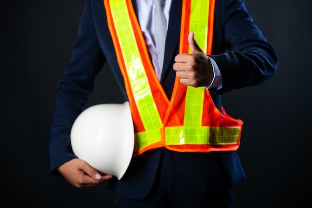 Portrait of a cheerful Young businessman construction site engineer,close up.