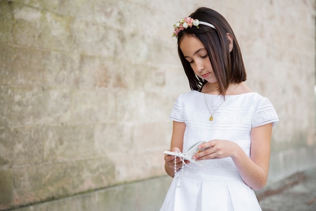 Portrait of child getting ready for their first communion