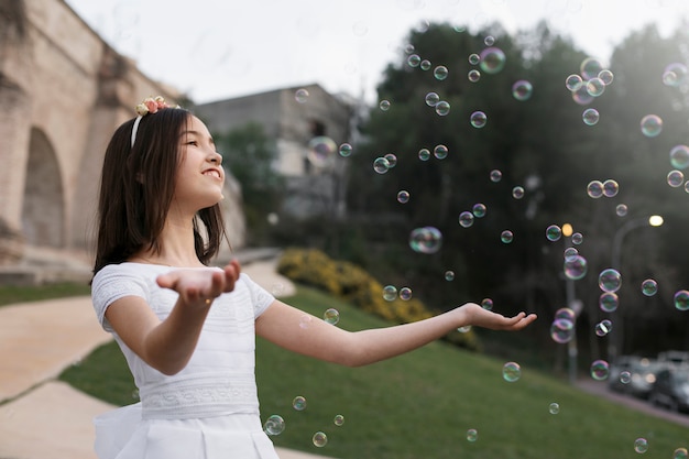 Free Photo portrait of child getting ready for their first communion